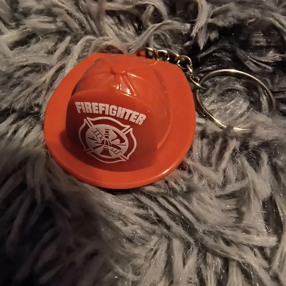 Red and white fireman’s hat keychain with light